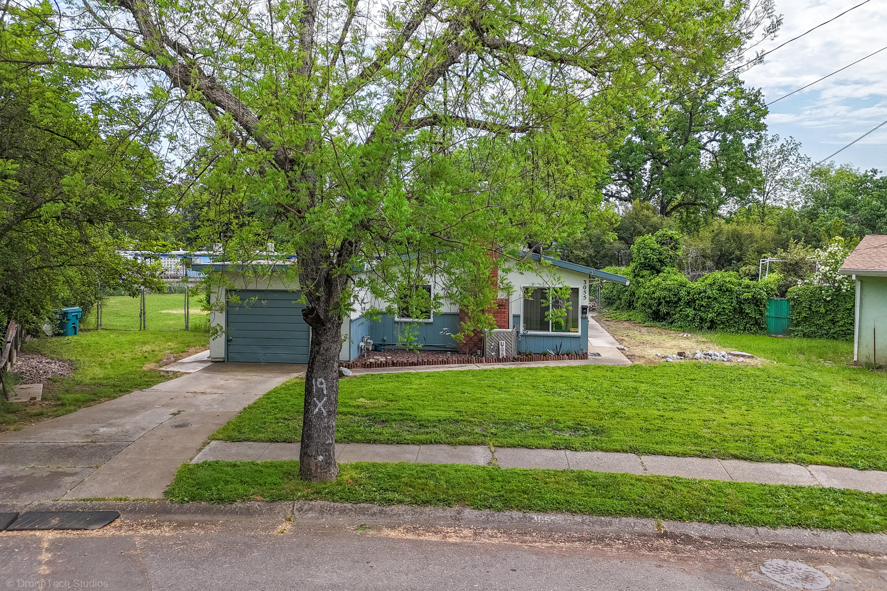3055 Sharon Avenue Anderson, CA 96007 - Photo 40 of 52 a front view of a house with a yard