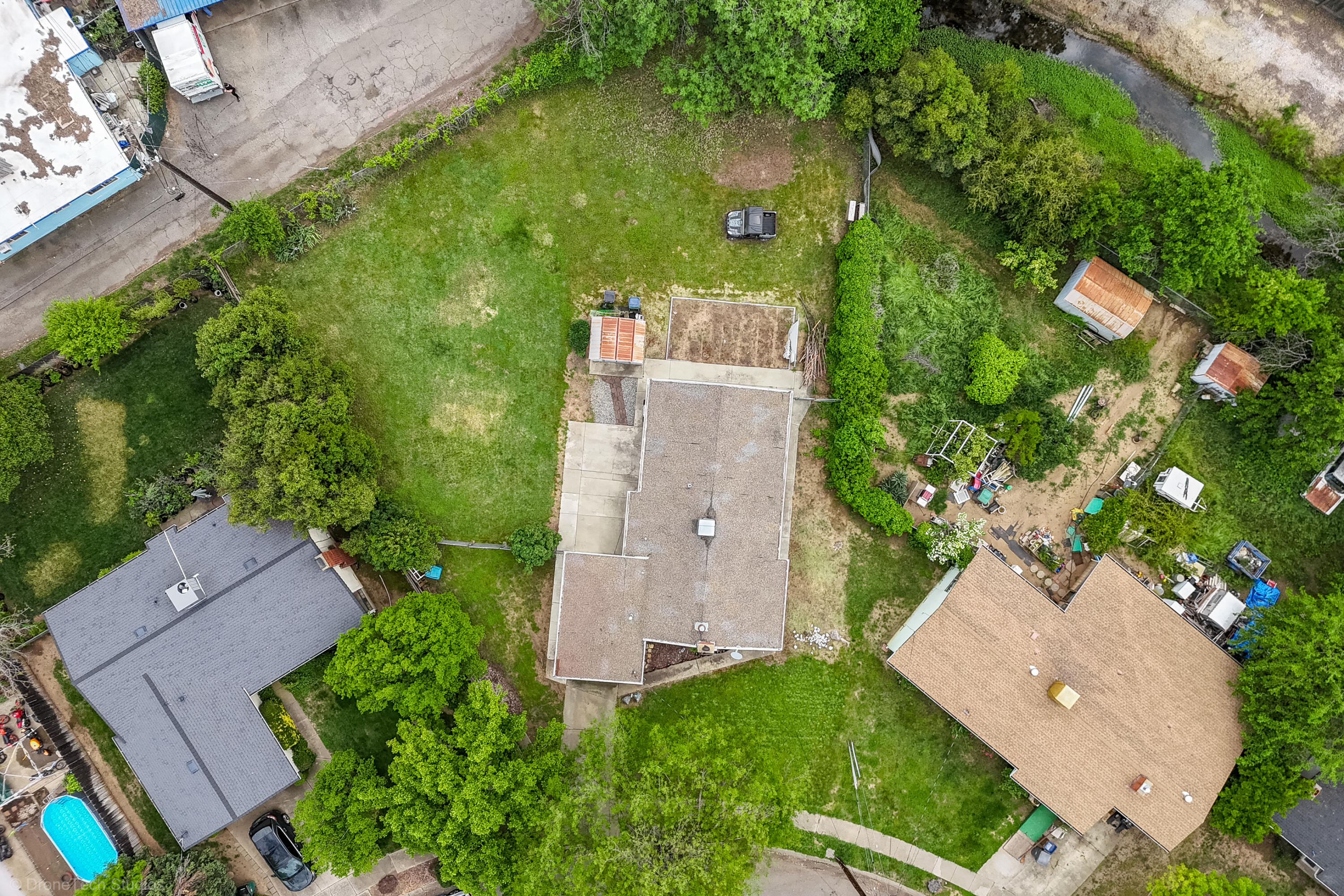 3055 Sharon Avenue Anderson, CA 96007 - Photo 51 of 52 an aerial view of a house with a yard and trees all around