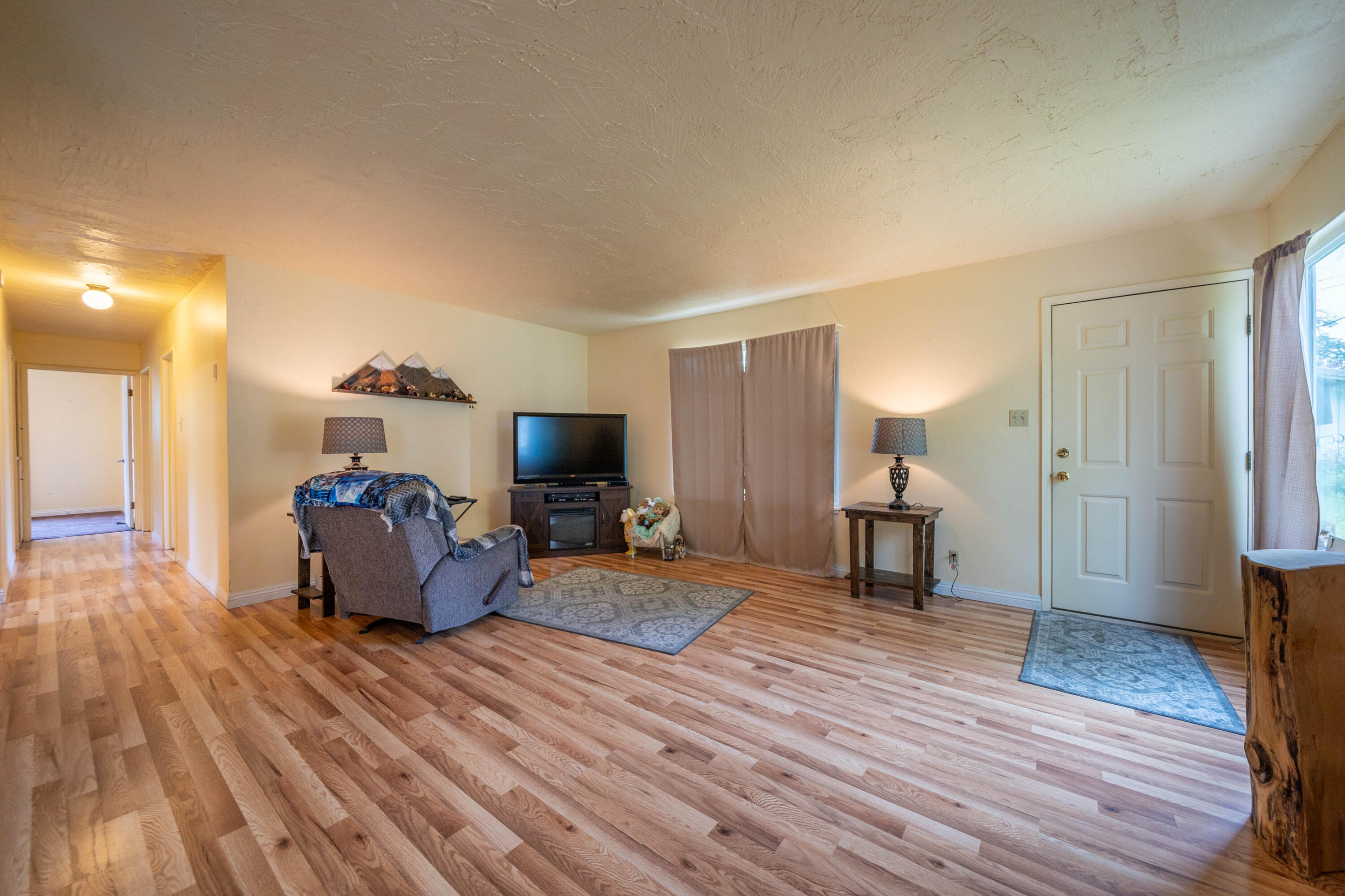3055 Sharon Avenue Anderson, CA 96007 - Photo 8 of 52 a living room with furniture and a wooden floor