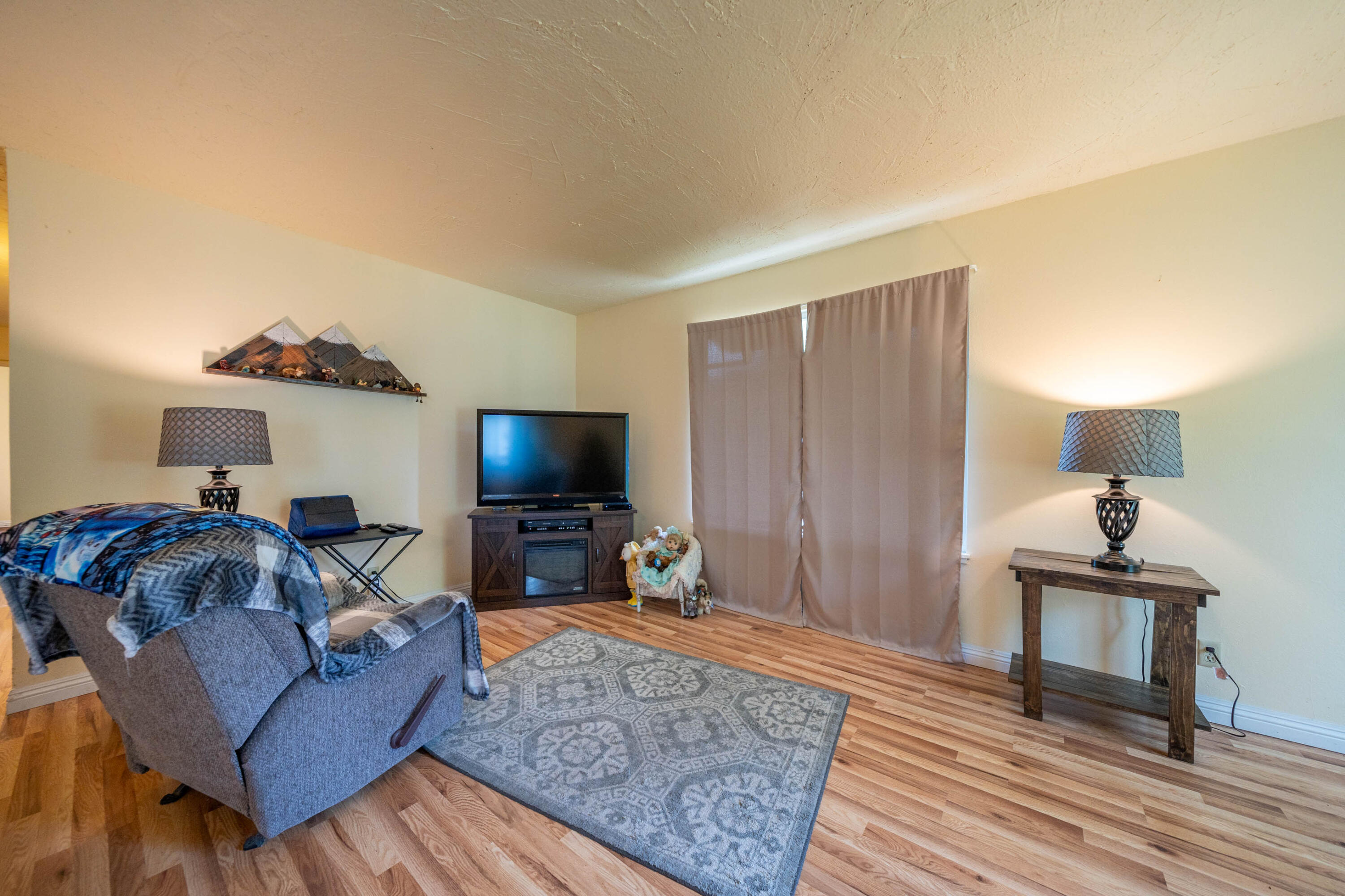 3055 Sharon Avenue Anderson, CA 96007 - Photo 10 of 52 a living room with furniture and a flat screen tv