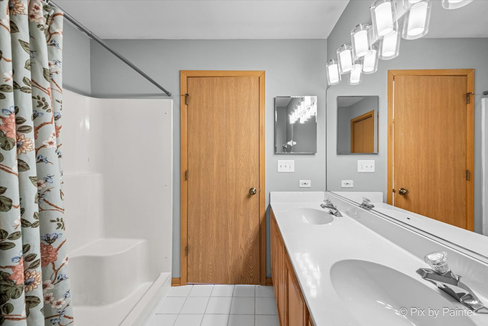 2466 Amber Lane Elgin, IL 60123 - Photo 16 of 32 a bathroom with a sink a toilet and shower