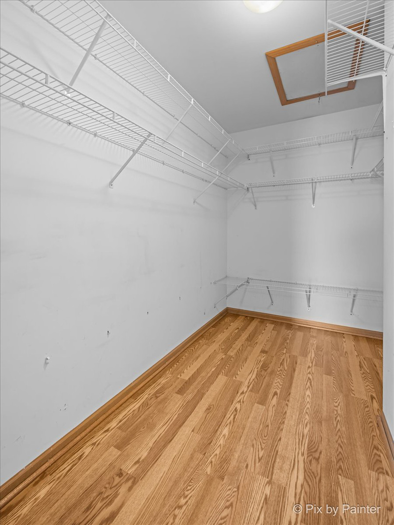 2466 Amber Lane Elgin, IL 60123 - Photo 17 of 32 a view of empty room with wooden floor