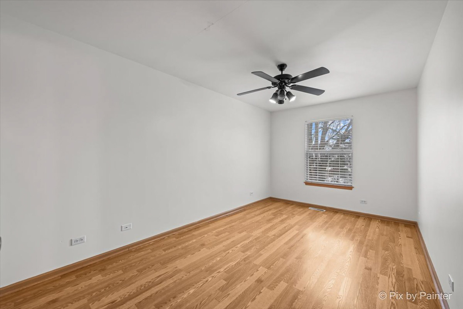 2466 Amber Lane Elgin, IL 60123 - Photo 18 of 32 an empty room with windows and fan
