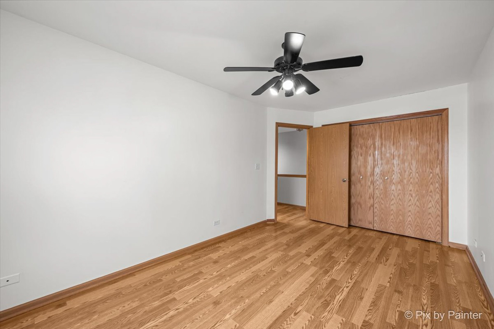 2466 Amber Lane Elgin, IL 60123 - Photo 19 of 32 an empty room with wooden floor closet and windows