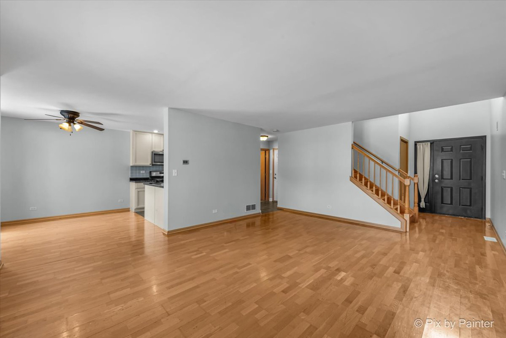 2466 Amber Lane Elgin, IL 60123 - Photo 3 of 32 a view of an empty room with wooden floor