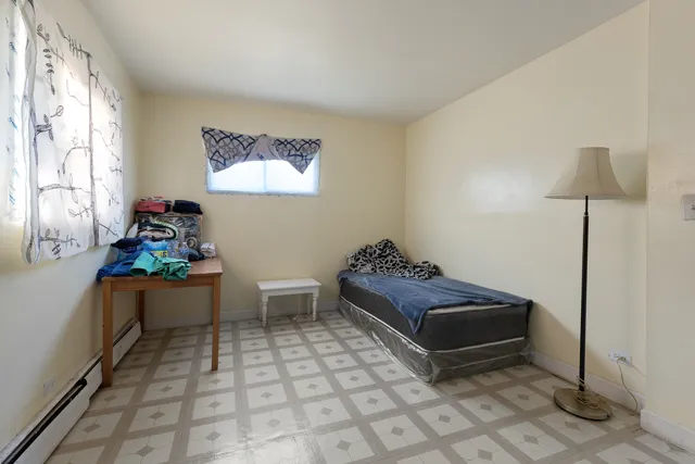 a living room with furniture a window and a table