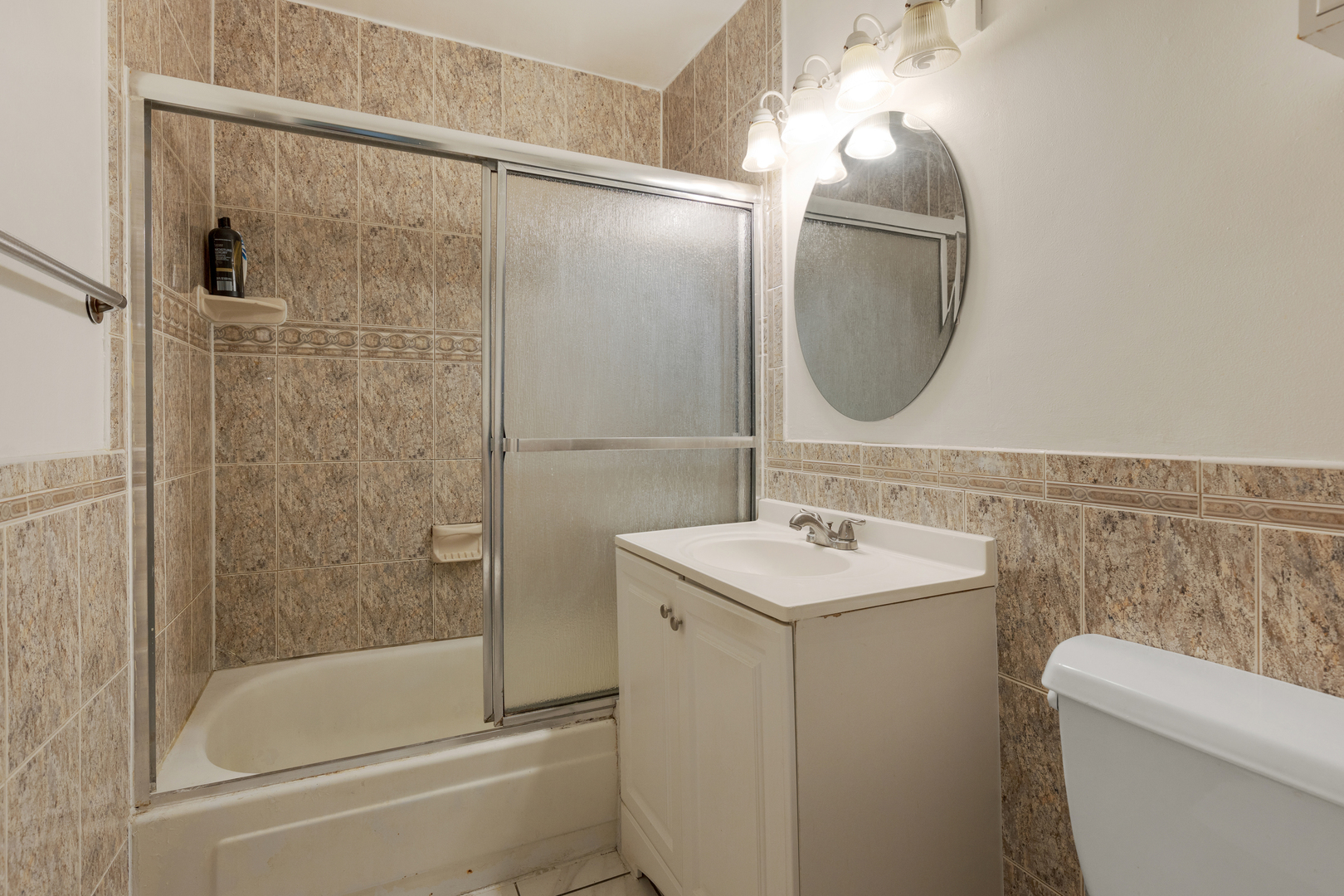 2508 West Algonquin Road, Unit 16 Rolling Meadows, IL 60008 - Photo 7 of 13 a bathroom with a sink toilet and shower