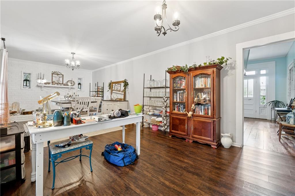 475 Evergreen Road Northeast Resaca, GA 30735 - Photo 18 of 44 a kitchen with stainless steel appliances granite countertop a sink dishwasher stove and white cabinets with wooden floor