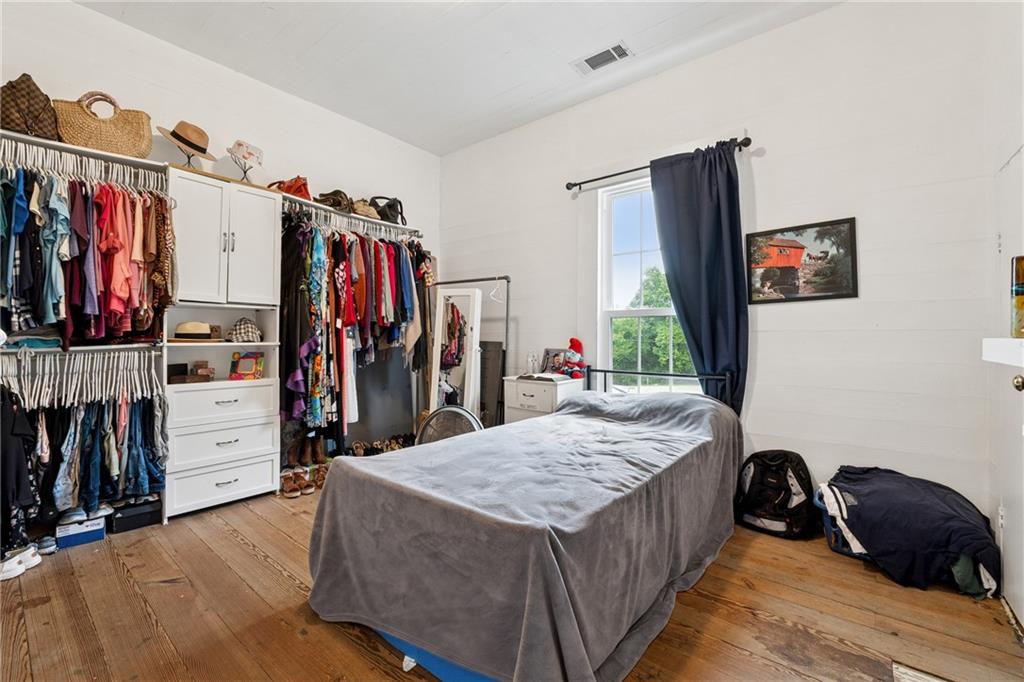 475 Evergreen Road Northeast Resaca, GA 30735 - Photo 21 of 44 a bed room with a bed and a walk in closet