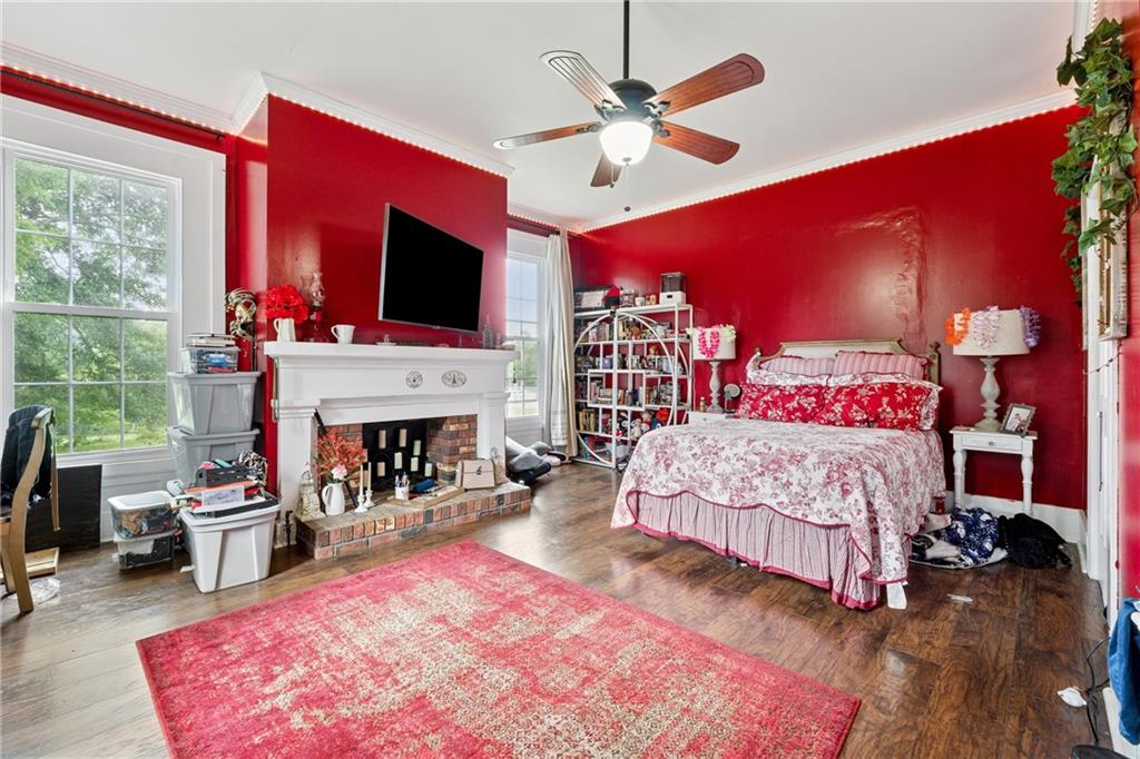 475 Evergreen Road Northeast Resaca, GA 30735 - Photo 24 of 44 a bed room with a bed and a fireplace