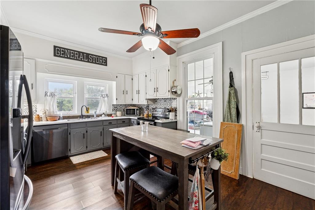 475 Evergreen Road Northeast Resaca, GA 30735 - Photo 41 of 44 a kitchen with a table chairs refrigerator and cabinets