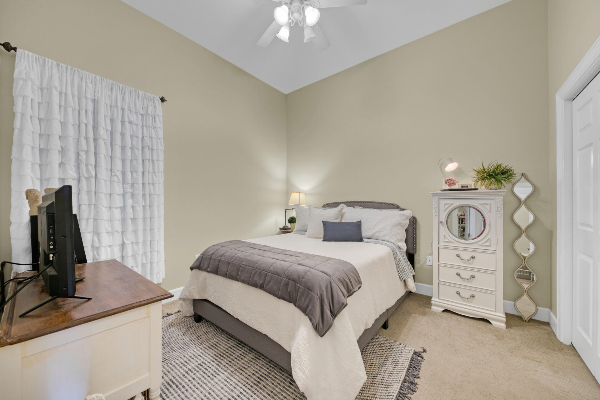 231 Somerset Bridge Road, Unit 1406 Santa Rosa Beach, FL 32459 - Photo 5 of 16 a bedroom with a bed and a chandelier