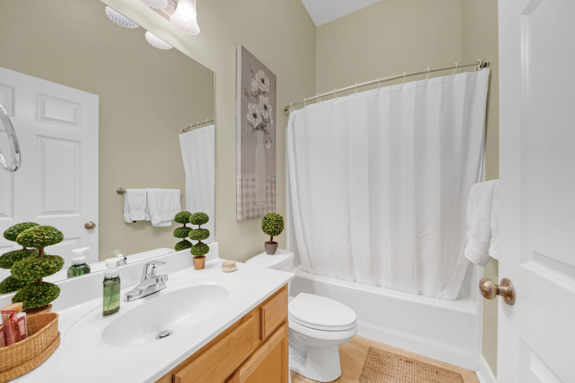 231 Somerset Bridge Road, Unit 1406 Santa Rosa Beach, FL 32459 - Photo 9 of 16 a bathroom with a sink a toilet and shower curtain