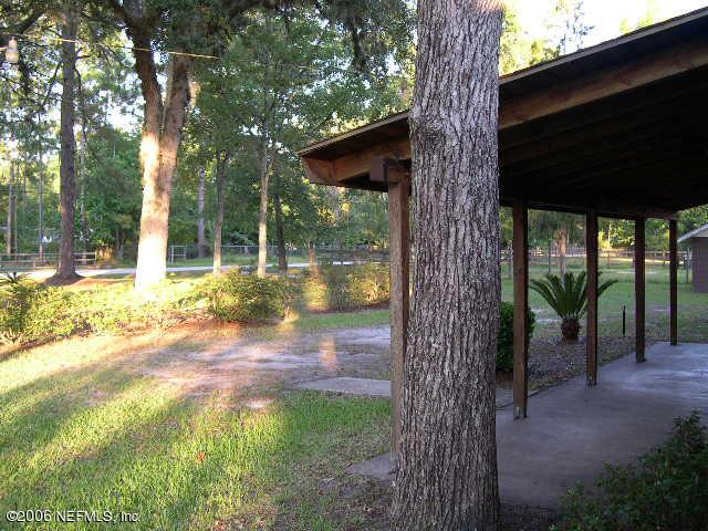 1116 Marlee Road Fruit Cove, FL 32259 - Photo 3 of 4 a view of a backyard with large tree