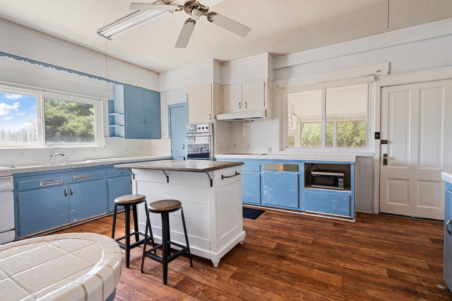 3101 River Road Vernalis, CA 95385 - Photo 16 of 81 a kitchen with granite countertop a stove a sink and a refrigerator