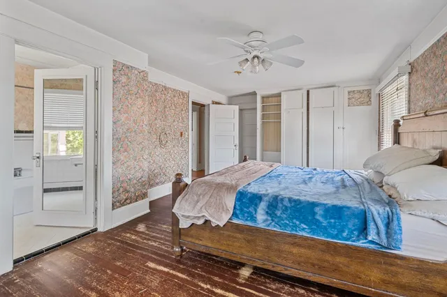 a kitchen with a table chairs sink and cabinets