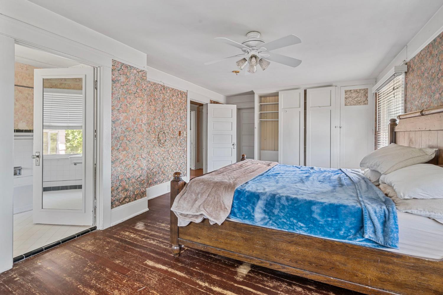 3101 River Road Vernalis, CA 95385 - Photo 35 of 81 a bedroom with a large bed and a chandelier