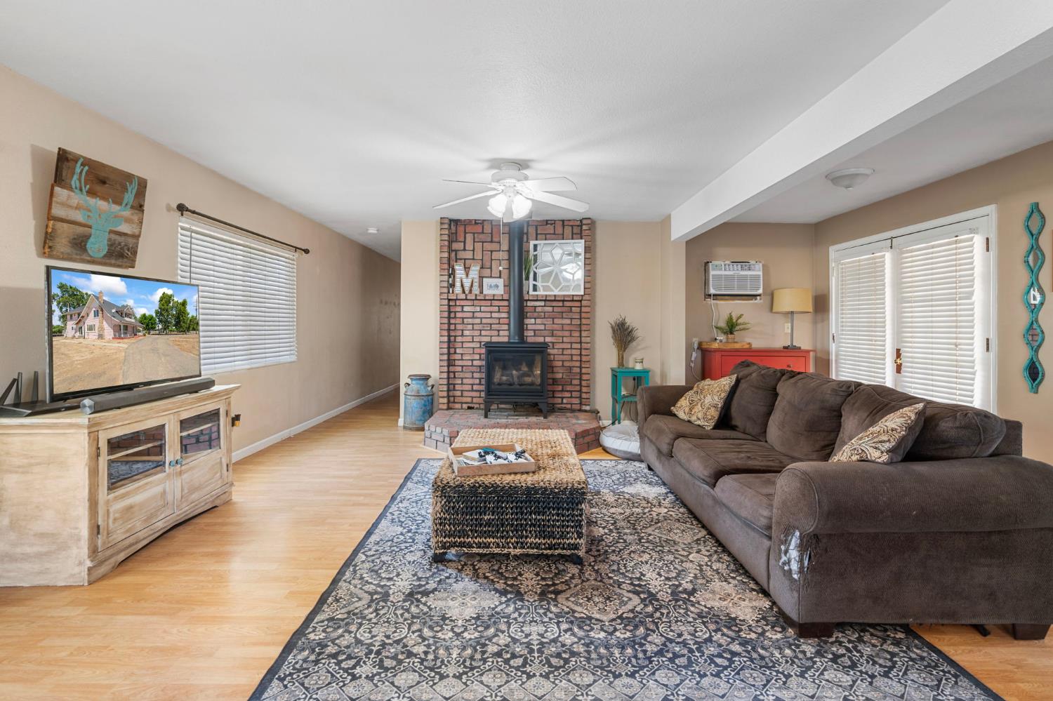 3101 River Road Vernalis, CA 95385 - Photo 47 of 81 a living room with furniture and a flat screen tv