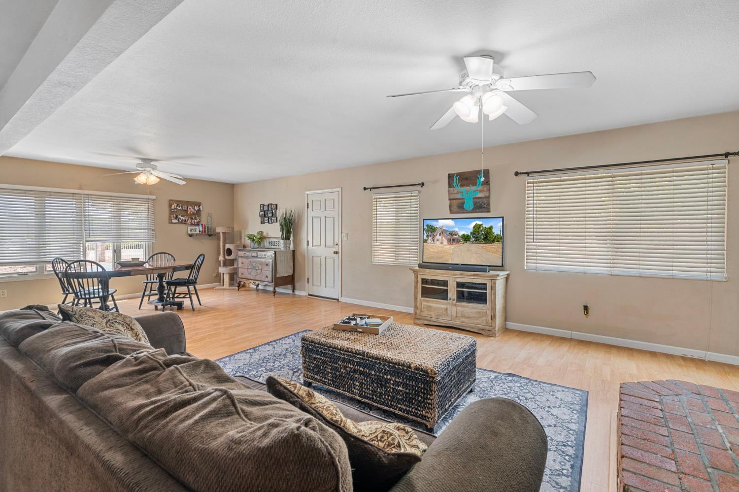 3101 River Road Vernalis, CA 95385 - Photo 48 of 81 a living room with furniture and a flat screen tv