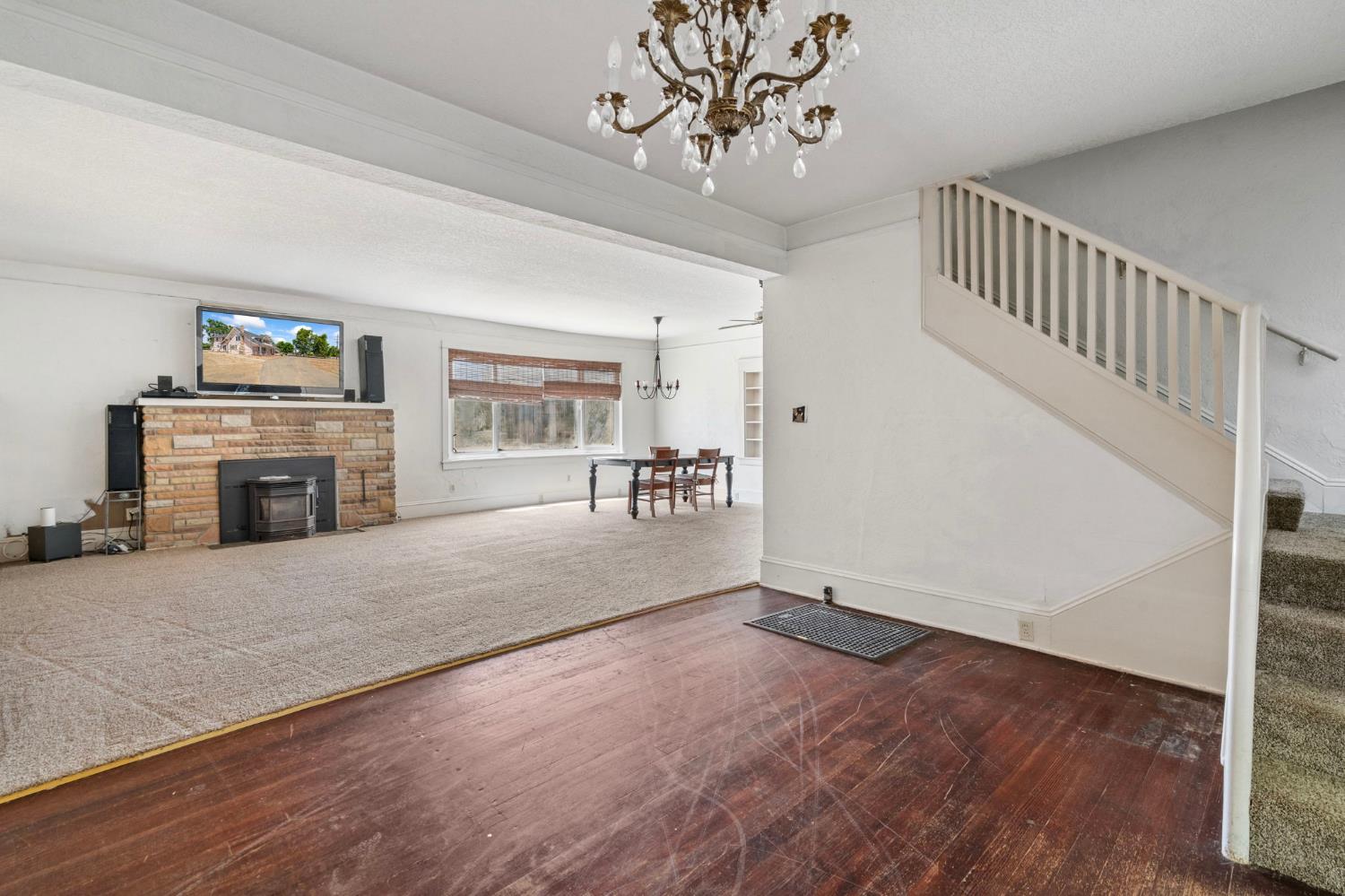 3101 River Road Vernalis, CA 95385 - Photo 5 of 81 a view of a livingroom with furniture a fireplace wooden floor and staircase