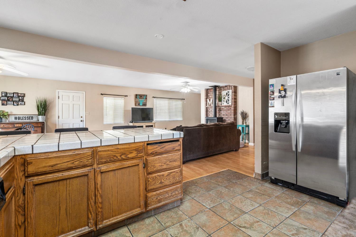 3101 River Road Vernalis, CA 95385 - Photo 55 of 81 a kitchen with stainless steel appliances granite countertop a refrigerator and a stove top oven