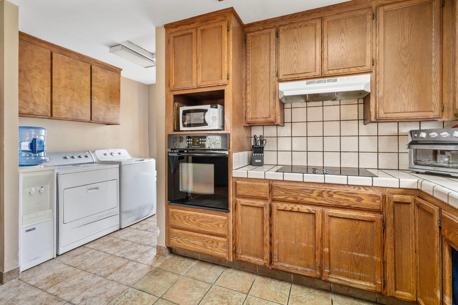 3101 River Road Vernalis, CA 95385 - Photo 56 of 81 a kitchen with stainless steel appliances granite countertop a sink and cabinets