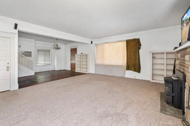 a kitchen with a stove a sink and a refrigerator