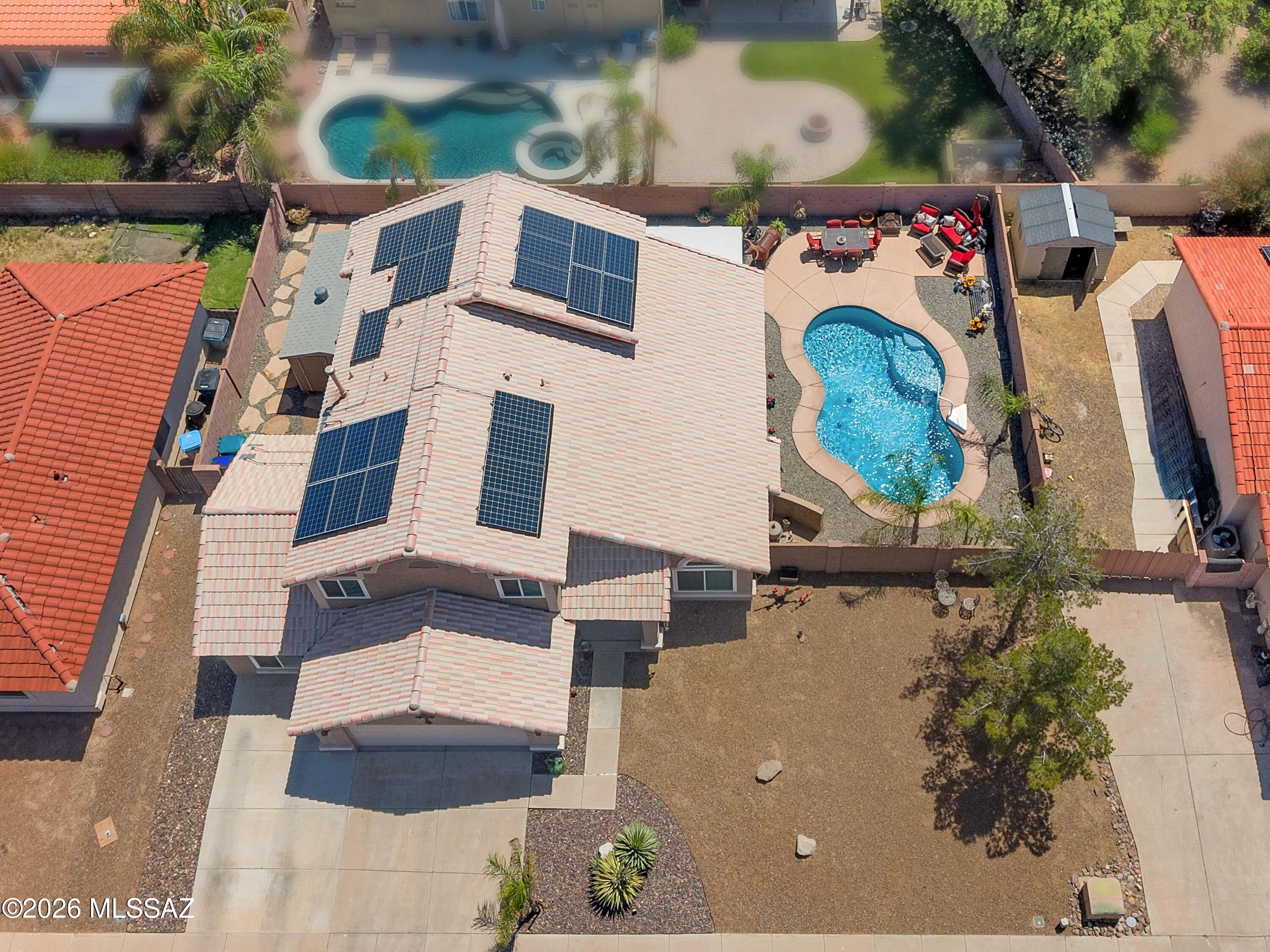 7159 West Maple Ridge Drive Tucson, AZ 85743 - Photo 32 of 42 an aerial view of residential houses with outdoor space