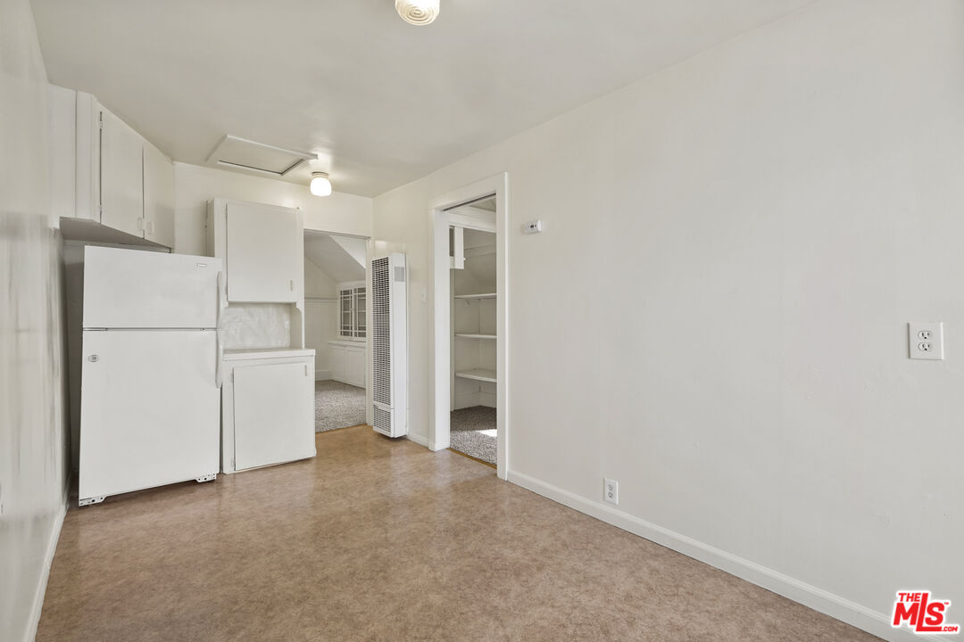 351 Temple Avenue, Unit A Long Beach, CA 90814 - Photo 11 of 18 a view of an empty room with a kitchen