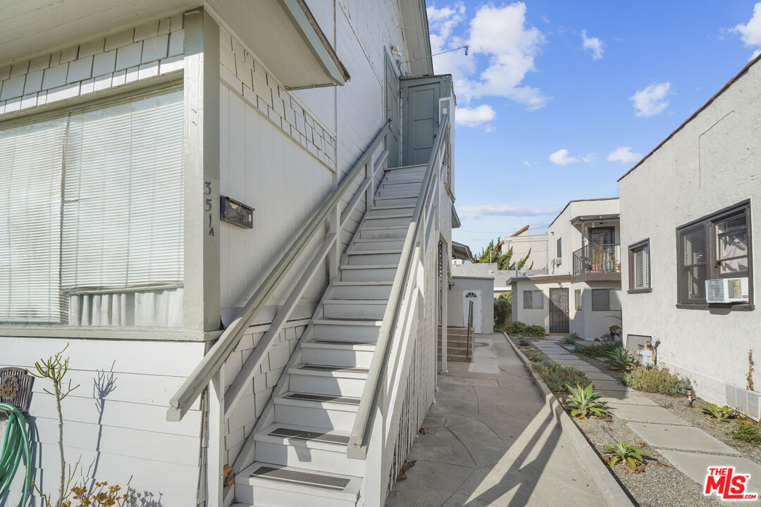 351 Temple Avenue, Unit A Long Beach, CA 90814 - Photo 2 of 18 a view of a livingroom with wooden floor and stairs