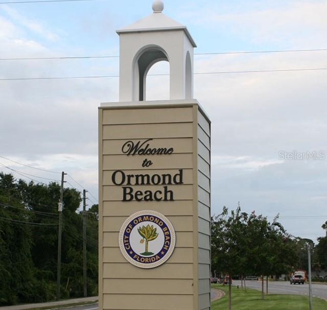 7 Brookside Circle Ormond Beach, FL 32174 - Photo 15 of 16 a view of a door with a sign on the wall