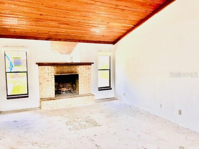 7 Brookside Circle Ormond Beach, FL 32174 - Photo 3 of 16 a view of empty room with a fireplace