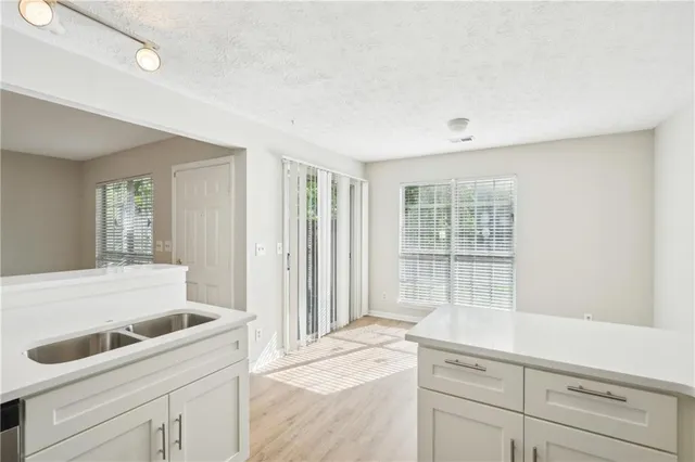 a kitchen with a sink and cabinets