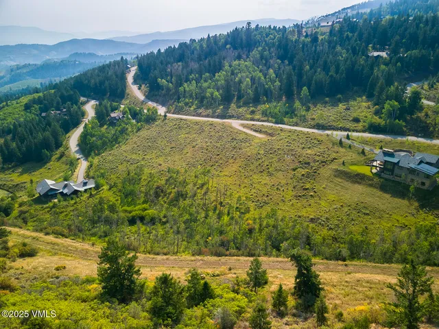 a view of a town with mountains in the background