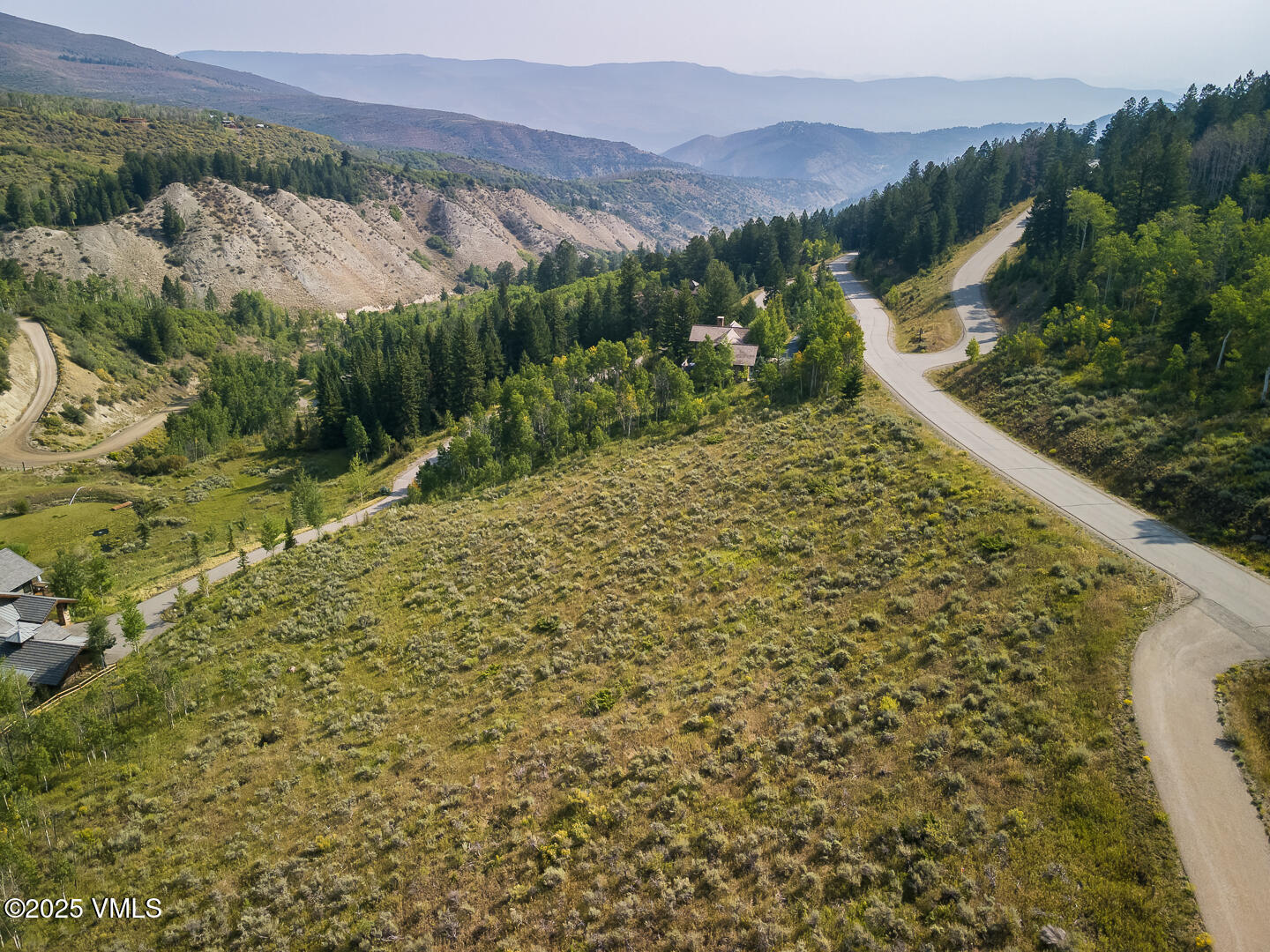 534 Graham Road Edwards, CO 81632 - Photo 44 of 54 a view of a backyard with plants and lake view