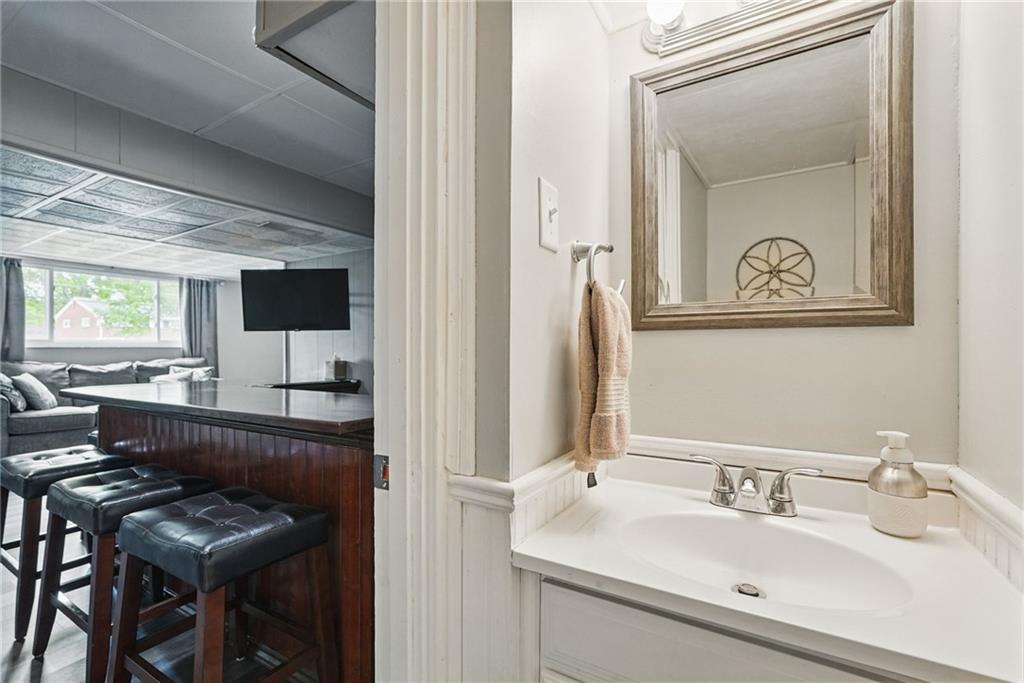 244 Burch Drive Coraopolis, PA 15108 - Photo 24 of 29 a bathroom with a sink a mirror and a bathtub
