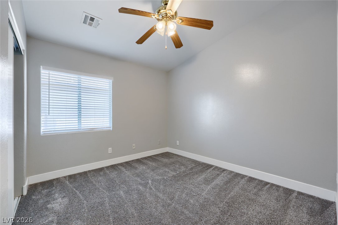 5985 High Steed Street, Unit 101 Henderson, NV 89011 - Photo 21 of 38 An inviting room boasts fresh carpet and an overhead fan, ready for personal touches.