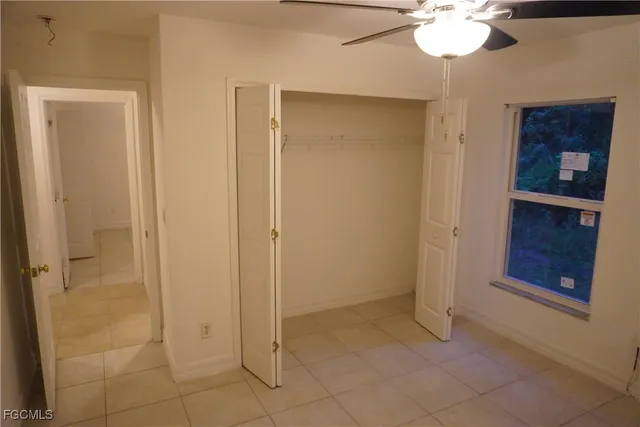 a view of an empty room with a bathroom