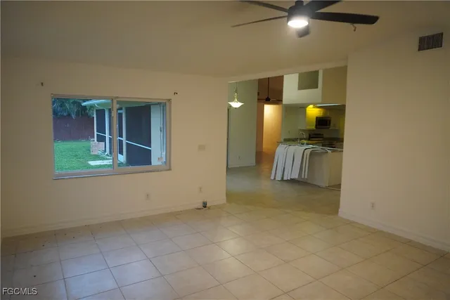 a view of a livingroom with a couch and cabinets