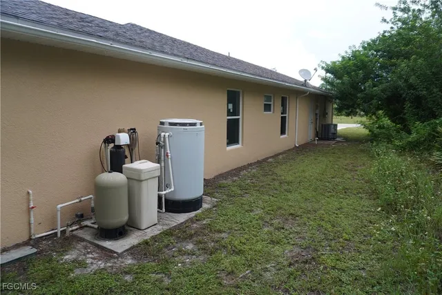 a view of a patio with a table and chairs