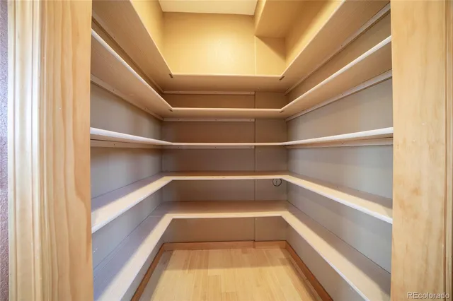 a bedroom with a large bed and a large window