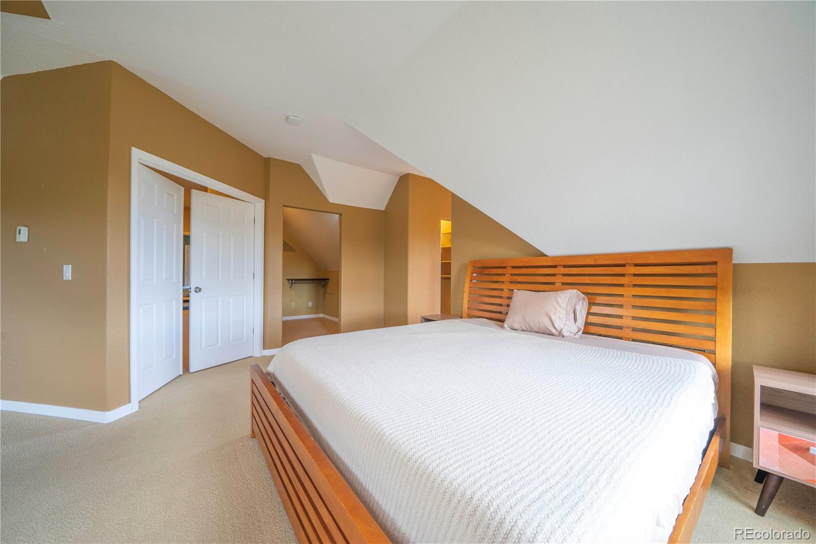 138 Teton Way Como, CO 80432 - Photo 14 of 34 a bedroom with a bed and a dresser