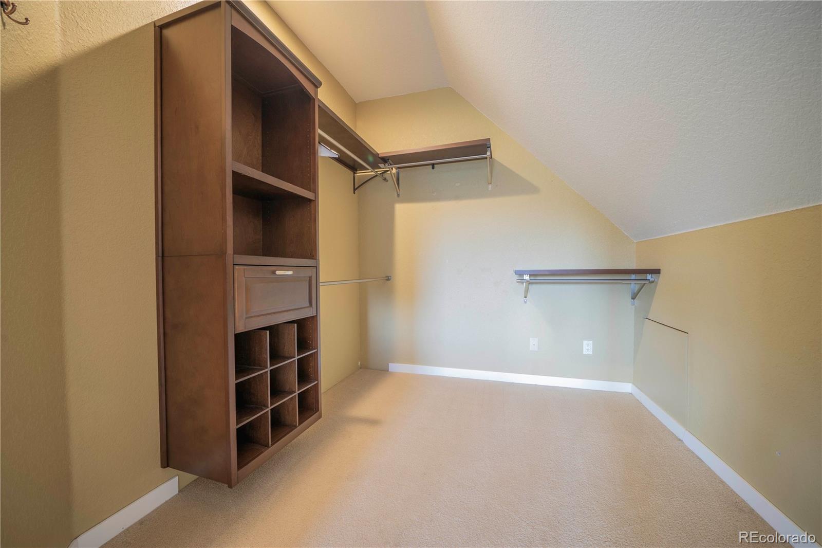 138 Teton Way Como, CO 80432 - Photo 18 of 34 a view of walk in closet with empty racks