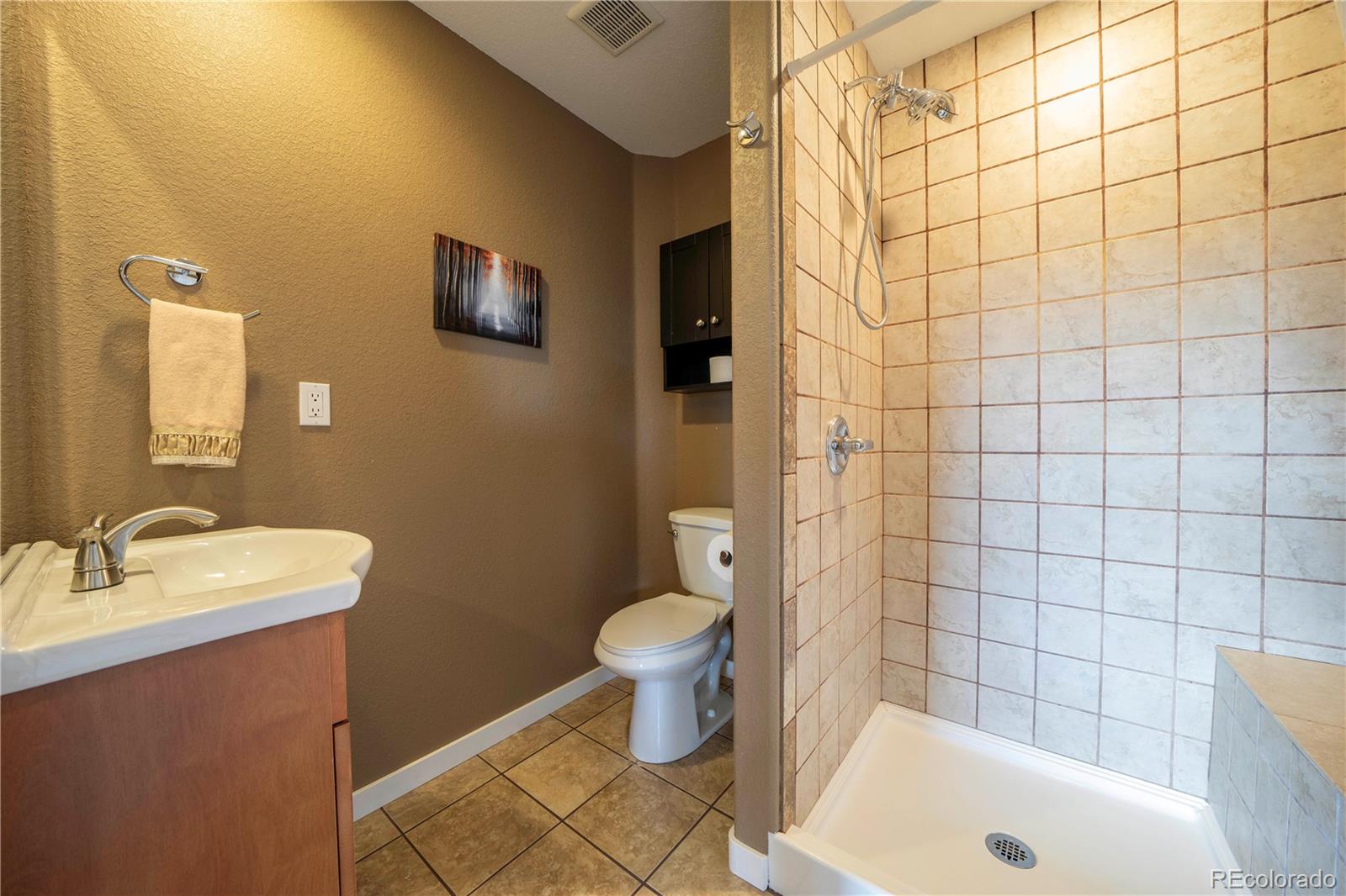 138 Teton Way Como, CO 80432 - Photo 20 of 34 a bathroom with a sink and a tub
