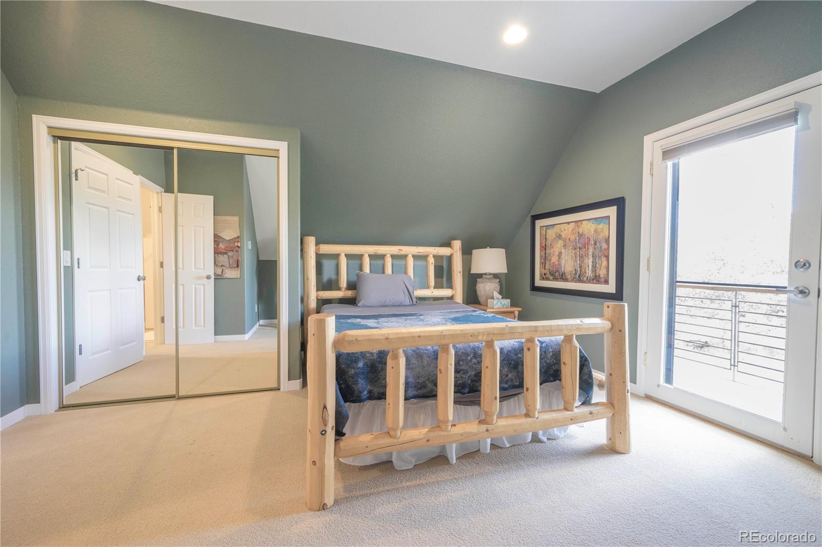 138 Teton Way Como, CO 80432 - Photo 23 of 34 a bedroom with a bed and a large window