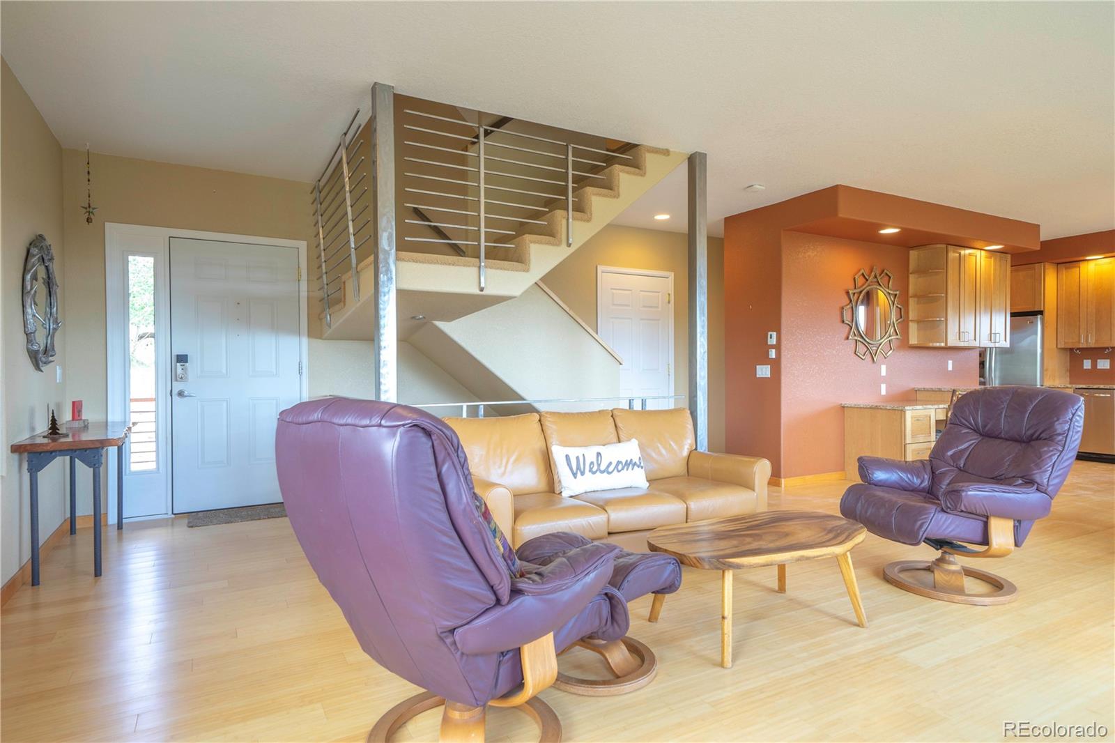 138 Teton Way Como, CO 80432 - Photo 27 of 34 a living room with furniture and wooden floor