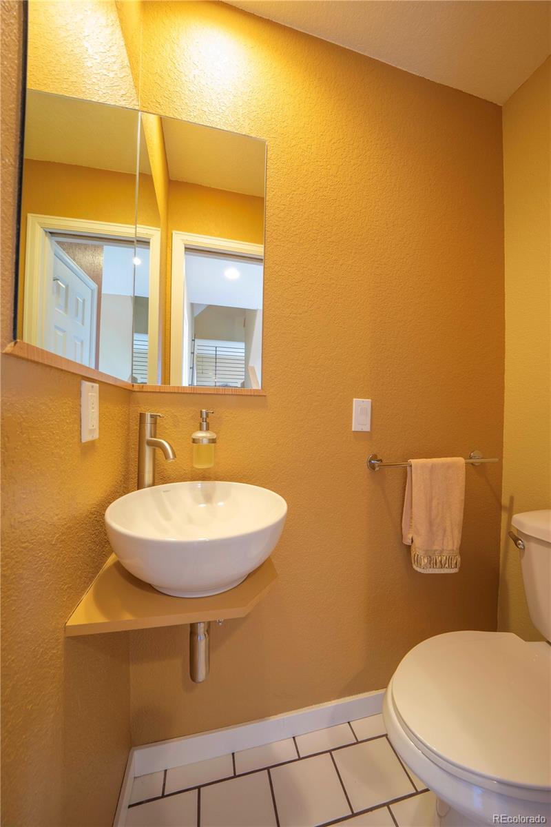 138 Teton Way Como, CO 80432 - Photo 33 of 34 a bathroom with a sink and a mirror