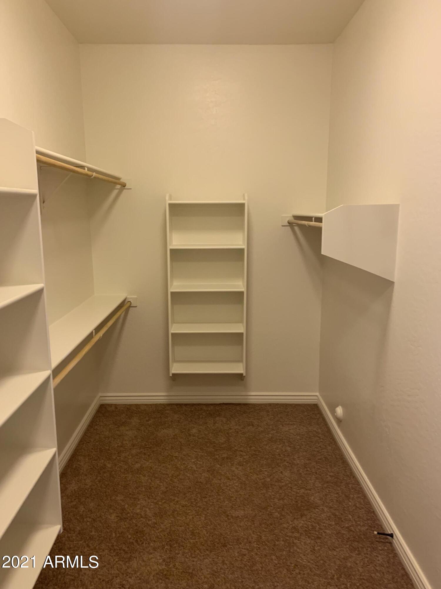 16705 West Quail Run Road Surprise, AZ 85387 - Photo 36 of 48 Master walk-in closet
