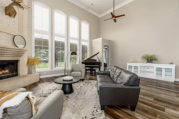 a living room with furniture a rug and a chandelier