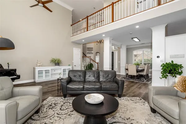 a bedroom with furniture and wooden floor